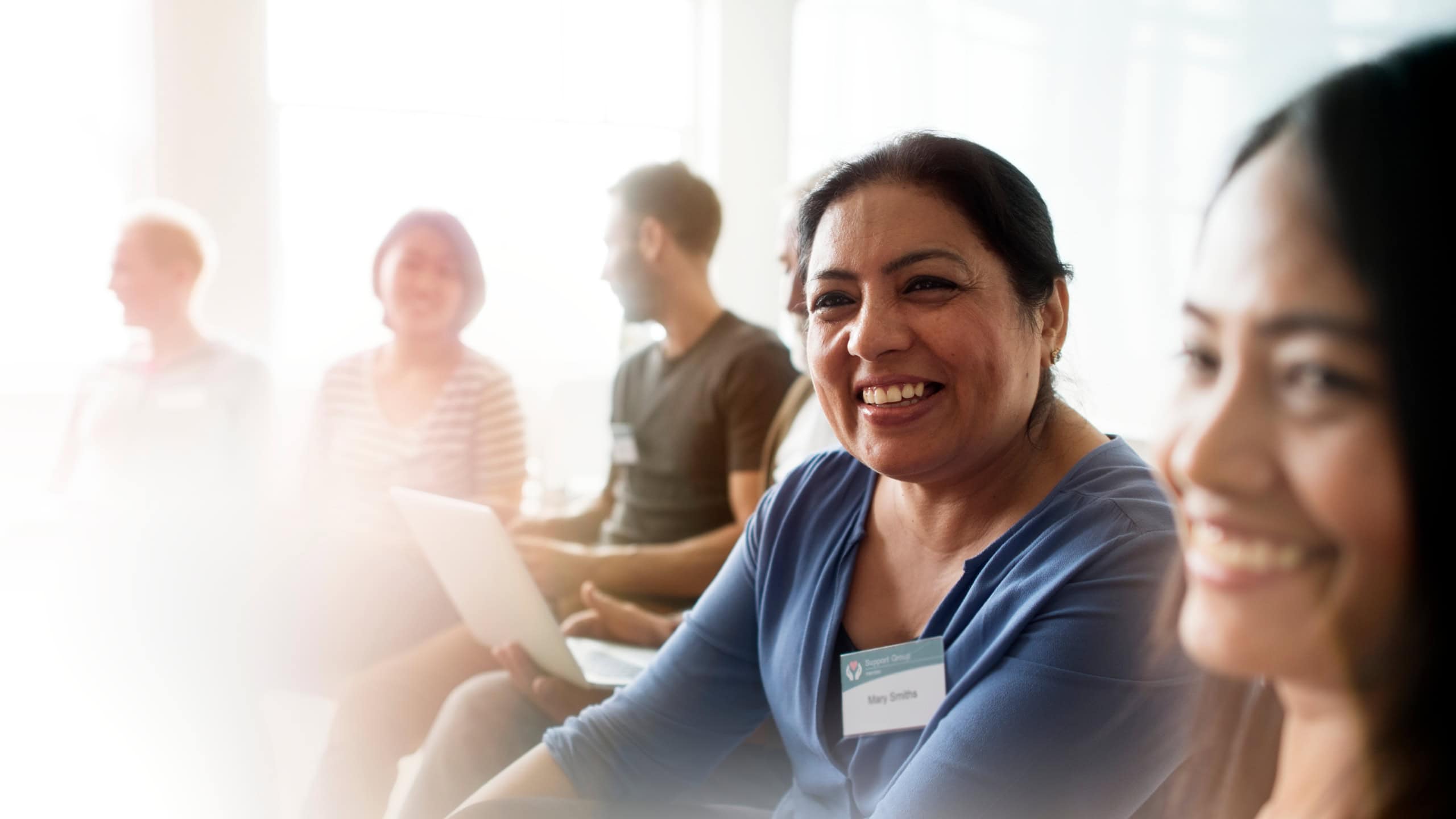 Diverse people in a support group meeting